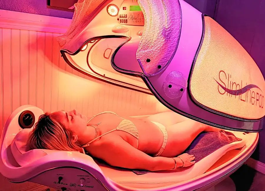 Young woman on LED light Bed
